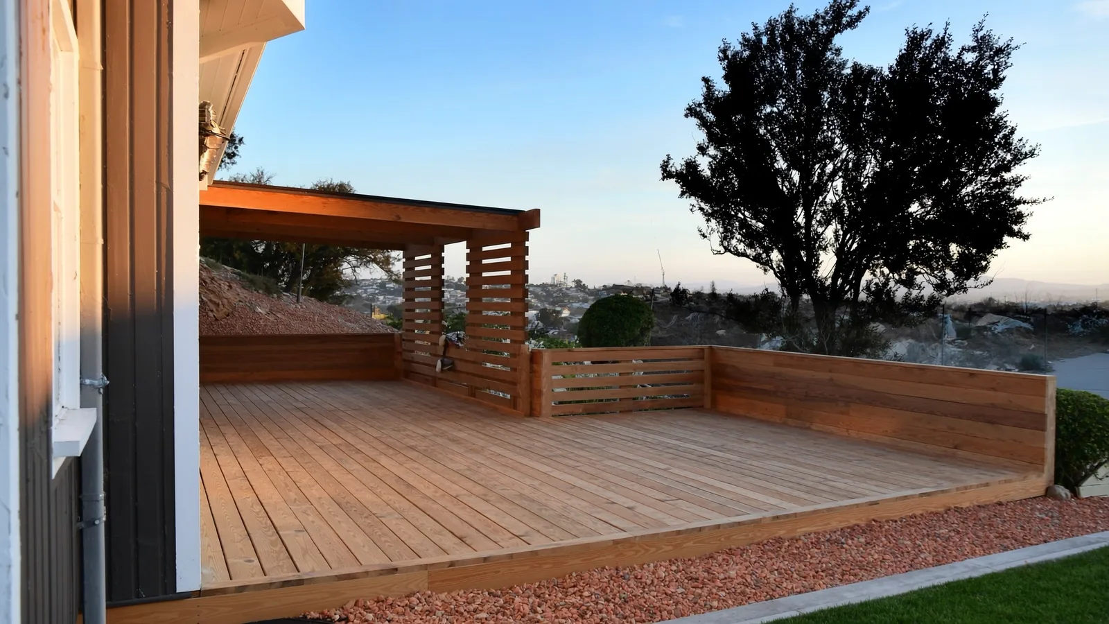 The same Tacoma deck after restoration — fresh composite decking, aluminum railing, and cedar pergola